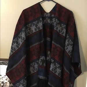 Beautiful shawl with fringes on bottom hem line.